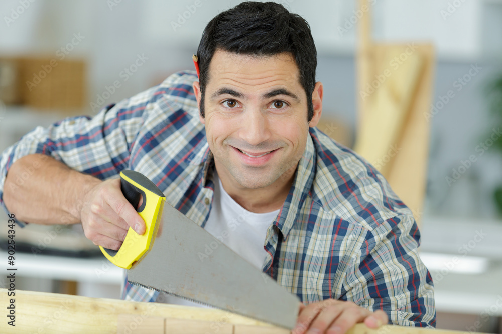 man sawing cutting wood board man sawing cutting wood board