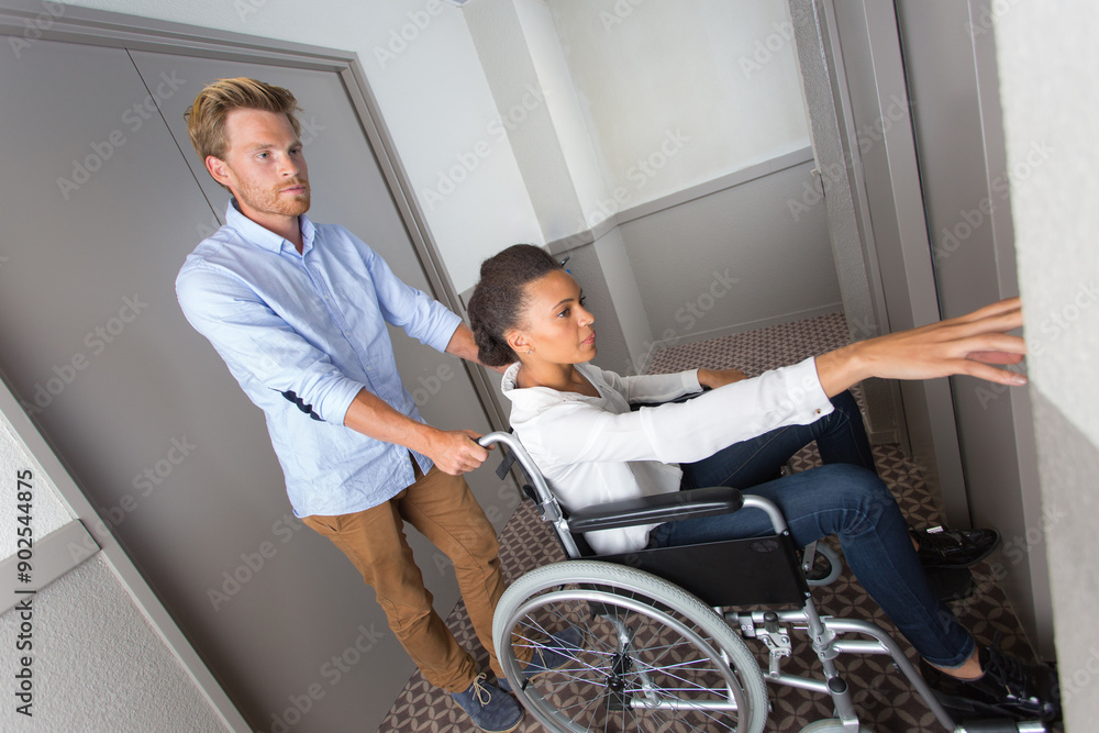 woman sitting in a wheelchair calling a lift woman sitting in a wheelchair calling a lift