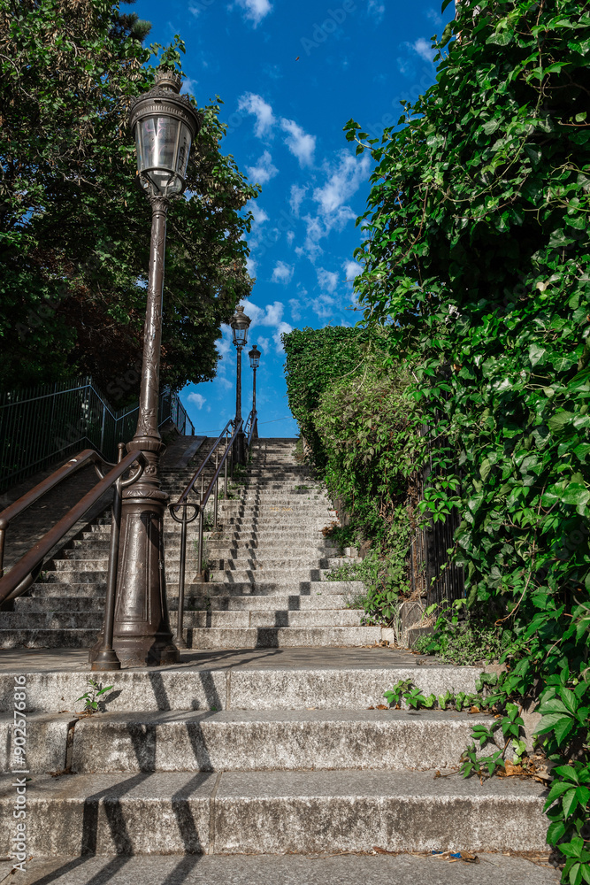 Stairs leading up to the top of the Montmartre hill in Paris, eastern access stairs to famous Sacre Couer or Holy Cross church overlooking Paris