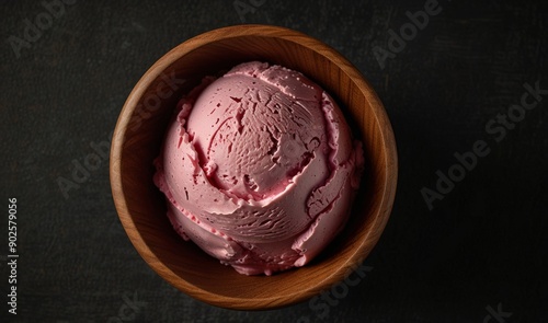 One rounded scoop black cherry ice cream with wooden bowl, top view on black background, photorealistic no cone