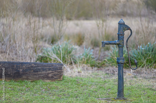 Old technology - a Victorian stand-pipe or hand pump for water in a field in North Yorkshire, UK. Horizontal landscape format.