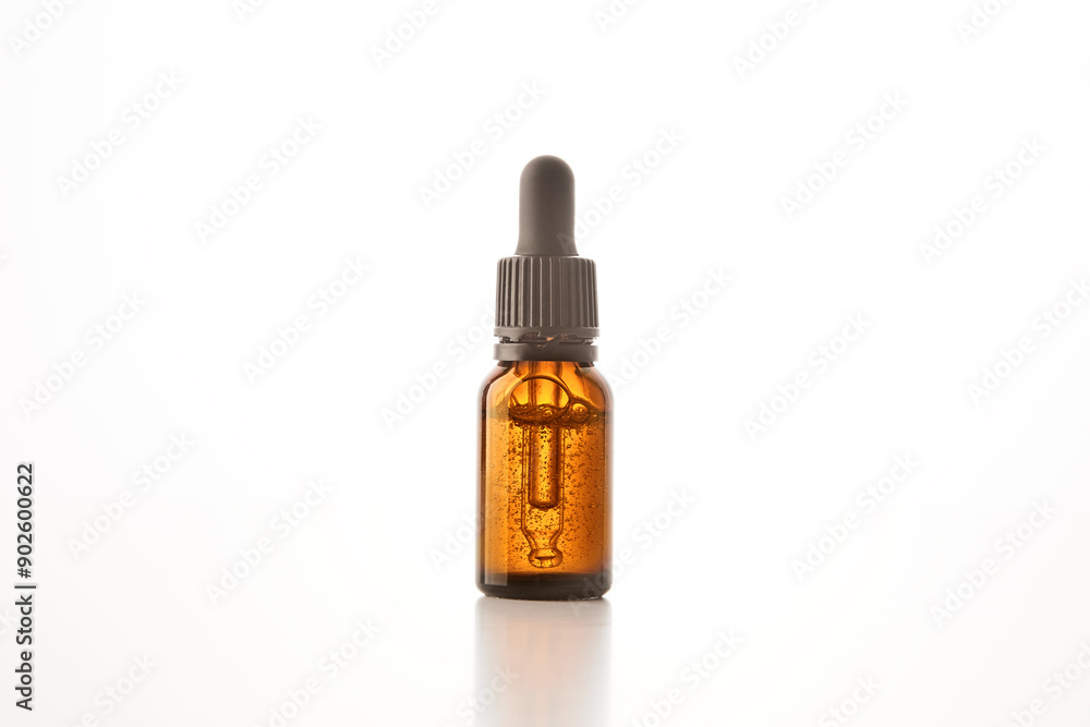 Brown glass container with pipette for cosmetic product. Brown glass container with pipette for cosmetic product.