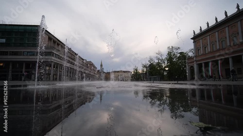 Reggio Emilia victory square bright colored fountains in time lapse video in front of the valli theater. High quality 4k footage photo