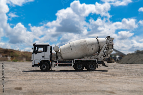 Concrete Truck or Cement mixer Industrial Machinery at Work as Cement Mixer Truck Heads to Construction Zone