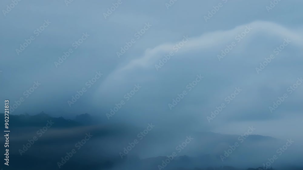 Whispers of mist dance delicately creating a soft and serene backdrop against the moody clouds above. Whispers of mist dance delicately creating a soft and serene backdrop against the moody clouds above.