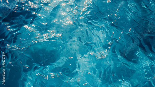 Vibrant blue water texture abstract ripples ocean pool sunlight reflection refreshing summer background clear teal deep sea sun reflection above drone view holiday Australia rock pool beach sunlight 