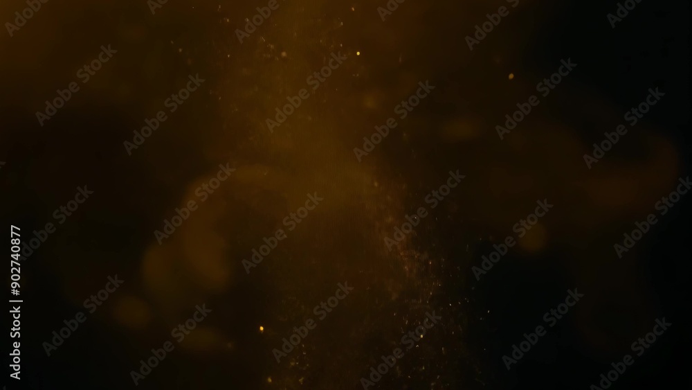Gold dust particles on a black background Gold dust particles on a black background