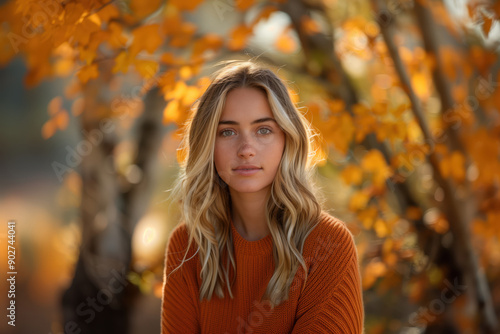 Woman in Autumn Fleece Clothing Surrounded by Vibrant Fall Foliage © anatoliycherkas