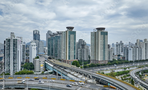 Jayang-dong, Gwangjin-gu, Seoul, South Korea - September 18, 2022: Aerial view of interchange with Cheongdam Bridge and Dongbu Expressway against Ttukseom Resort Station and apartments 