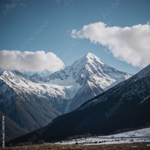 Snow covered mountains under a bright blue sky