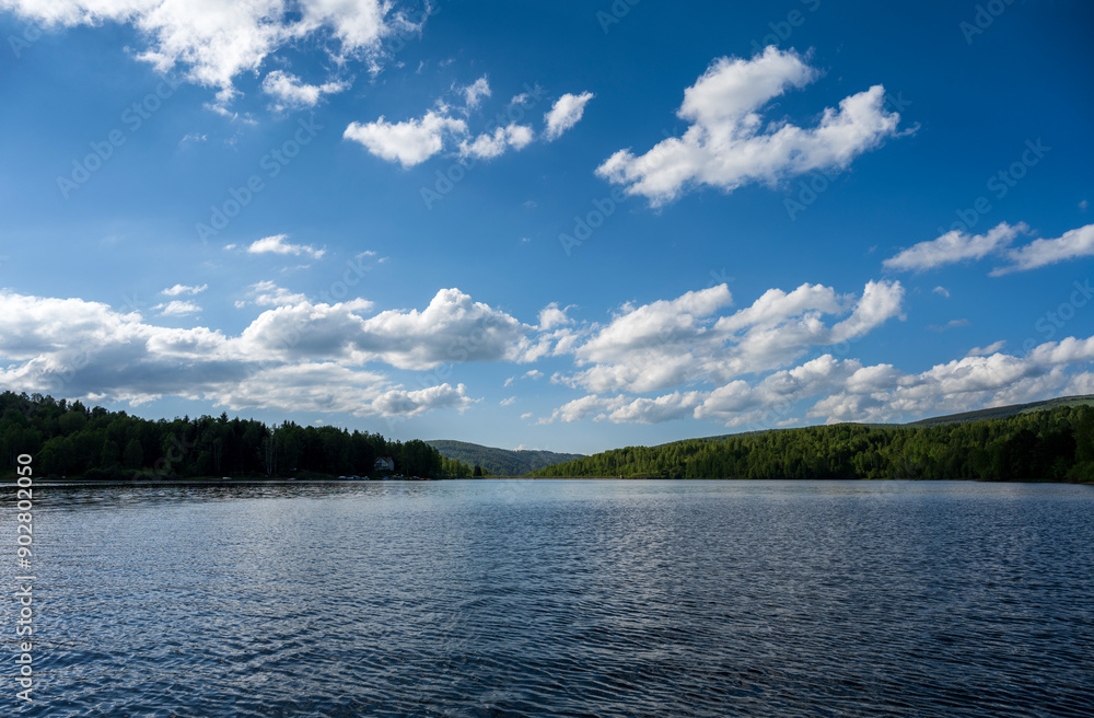 Vlasina lake scenery with beautiful clouds in the blue sky. Beautiful semi-artificial lake in Southeast Serbia. The beautiful blue color of the water. Vlasina lake scenery with beautiful clouds in the blue sky. Beautiful semi-artificial lake in Southeast Serbia. The beautiful blue color of the water.