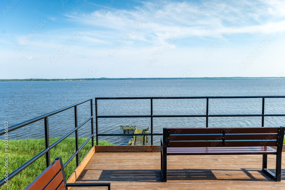 View from the observation tower towards Lake Lebsko. Benches placed on the upper viewing platform. Slowinski National Park, Leba, Poland