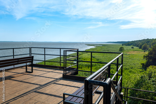 View from the observation tower towards Lake Lebsko. Benches placed on the upper viewing platform. Slowinski National Park, Leba, Poland