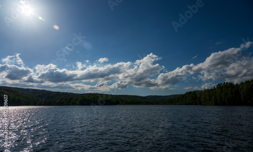 Sunset at Vlasina Lake. Vlasina lake scenery with beautiful clouds in the blue sky. Beautiful semi-artificial lake in Southeast Serbia.
 photo