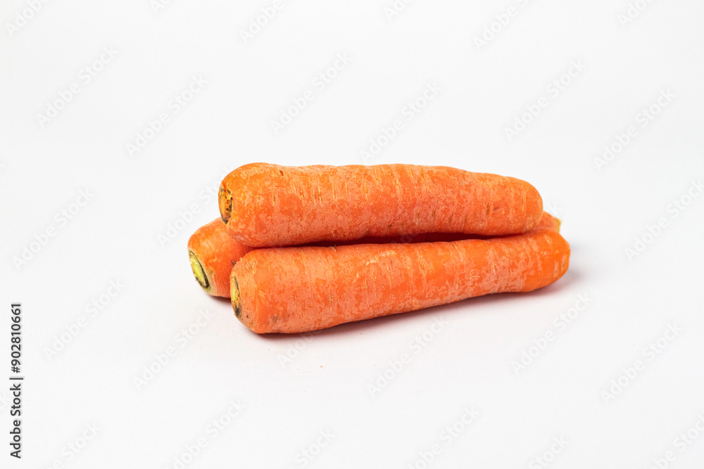 Fresh unpeeled organic carrot, isolated on white background.