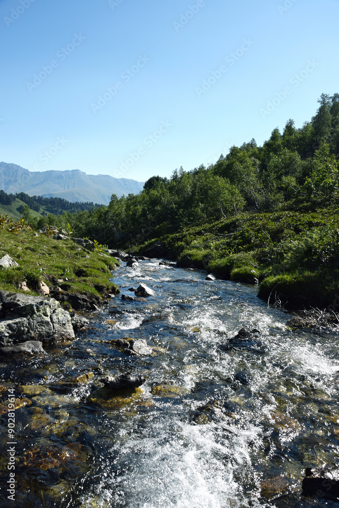 Obraz premium Valley of the mountain river Malaya Dukka in the mountains of the North Caucasus. Tourist trail to the lakes in the mountains of the Arkhyz resort, Karachay-Cherkessia, Russia