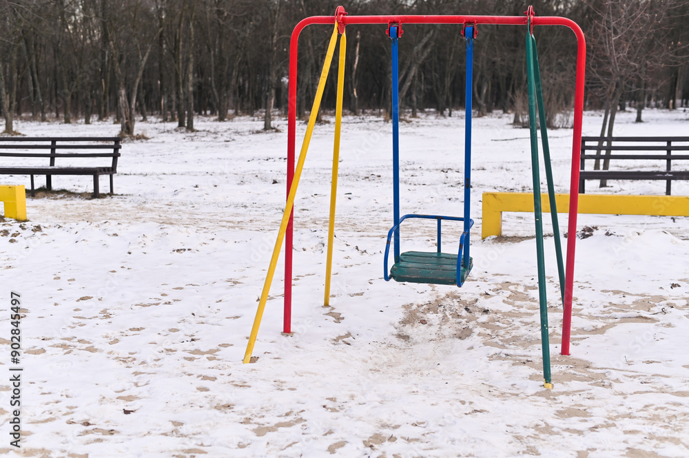 an empty children's swing n the park an empty children's swing n the park