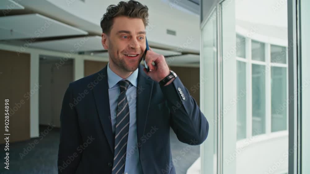 Happy director talking mobile phone walking at hallway office. Excited executive Happy director talking mobile phone walking at hallway office. Excited executive