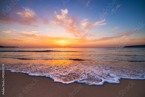 Fototapeta Naklejka Na Ścianę i Meble -  Beautiful sunrise over the sea sand and beach shore