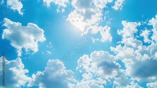 Blue Sky with White Fluffy Clouds and Sunlight
