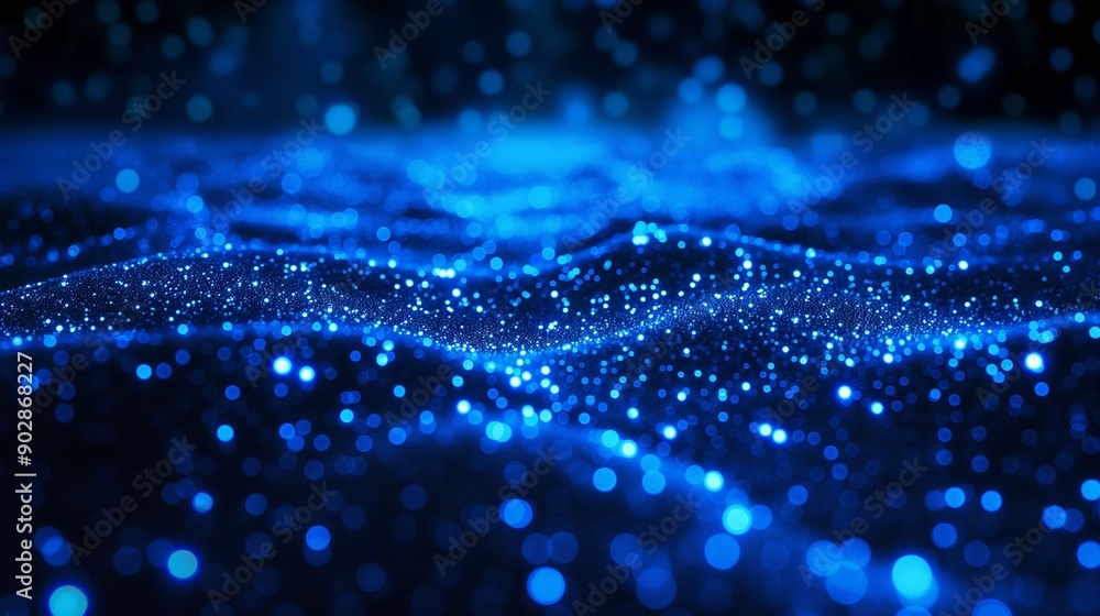 Bright blue sparkles glowing in a dark background. Bright blue sparkles glowing in a dark background.