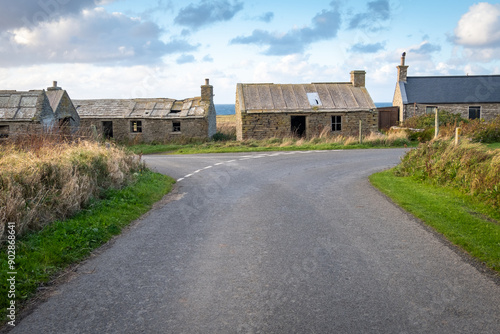 Old abandoned barn houses and cottages on the country road