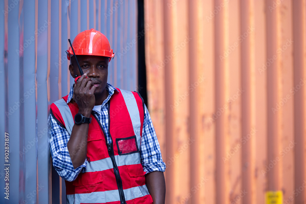 Man american african with talkie walkie at worker industry dock or container yard. foreman talking radio working control forklift loading cargo shipping transport. Man american african with talkie walkie at worker industry dock or container yard. foreman talking radio working control forklift loading cargo shipping transport.
