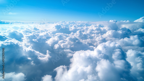 A scenic view of fluffy white clouds against a clear blue sky.