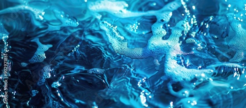 Stunning blue water texture captured in a macro photograph displaying a natural fluid art pattern with a copy space image