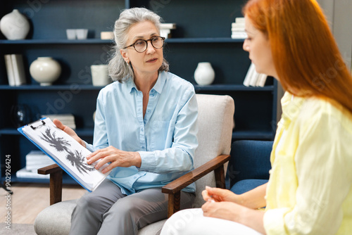 Bilde på lerret Experienced psychologist showing rorschach inkblot test to patient during therap