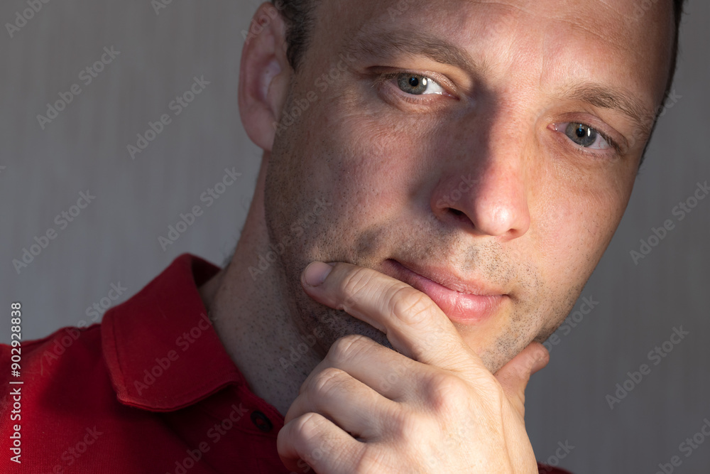 Fototapeta premium Face portrait of positive young adult Caucasian man, close up