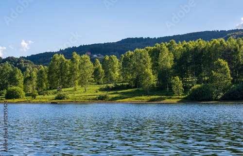 Vlasina lake scenery with beautiful clouds in the blue sky. Beautiful semi-artificial lake in Southeast Serbia.  photo