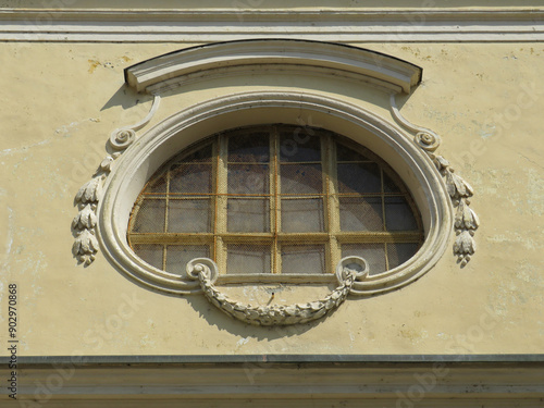 Detail of curvilinear window in the historic city center of Ivrea. Piedmont. Italy. photo