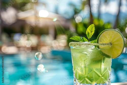 Refreshing Green Cocktail with Lime and Mint by a Pool