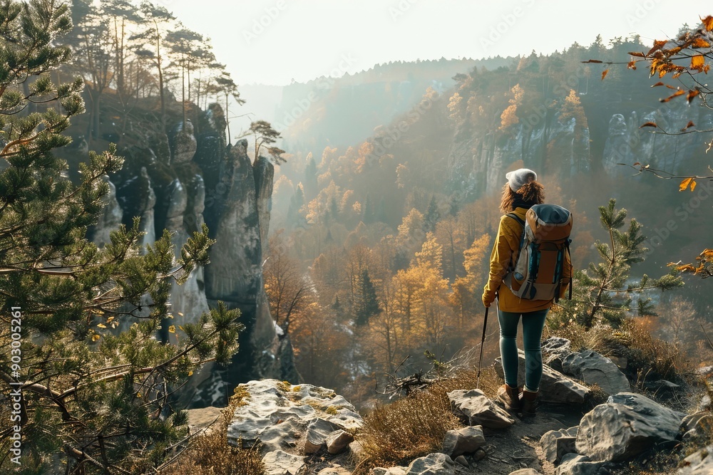 Obraz premium Active woman traveler walking along hiking trails in the mountains among forests and cliffs. Trekking, active lifestyle concept, Generative AI
