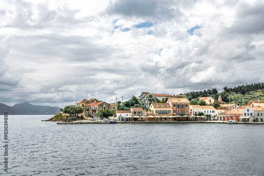 Fiskardo village on the Ionian Island of Kefalonia Greece, summer vacation destination, cloudy sky and beautiful landscape scenery Fiskardo village on the Ionian Island of Kefalonia Greece, summer vacation destination, cloudy sky and beautiful landscape scenery