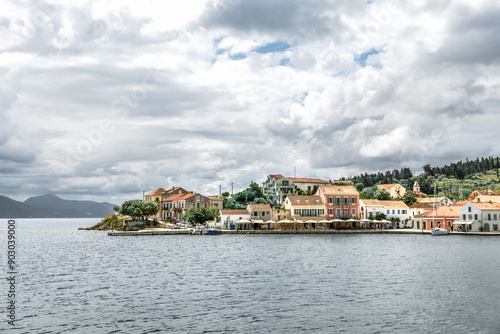 Fiskardo village on the Ionian Island of Kefalonia Greece, summer vacation destination, cloudy sky and beautiful landscape scenery