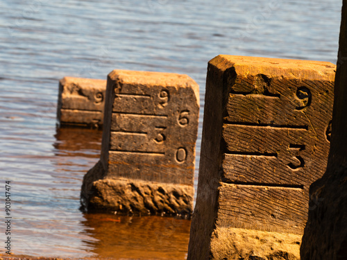 Reservoir engraved stone water marker level  photo