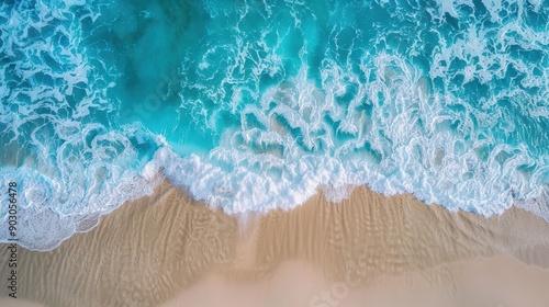 A stunning view of the turquoise ocean with gentle waves lapping against a sandy beach, perfect for a relaxed and summery backdrop