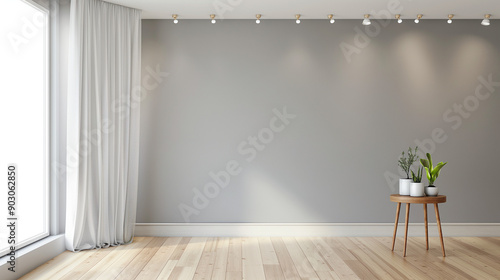 An empty room with a large gray wall on the left. A wooden floor with a light hue stretches across the room. On the right side of the wall, there's a white curtain