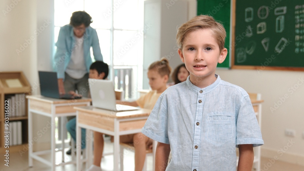 Fototapeta premium Caucasian cute student looking at camera while friend studying about writing engineering code or coding prompt. Professional smart teacher checking prompt while teaching about AI generated. Pedagogy.