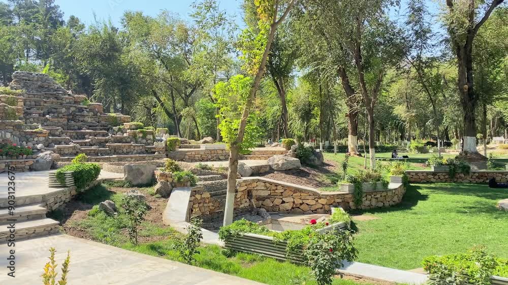 Kabul, Afghanistan - 12 th october, 2023: Shahr-e Naw park view with muslim men relax socialize on grassy area in nature Kabul, Afghanistan - 12 th october, 2023: Shahr-e Naw park view with muslim men relax socialize on grassy area in nature