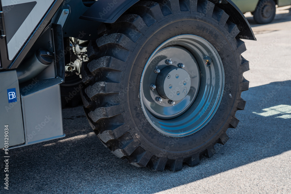Large industrial machinery tire close up for construction works Large industrial machinery tire close up for construction works