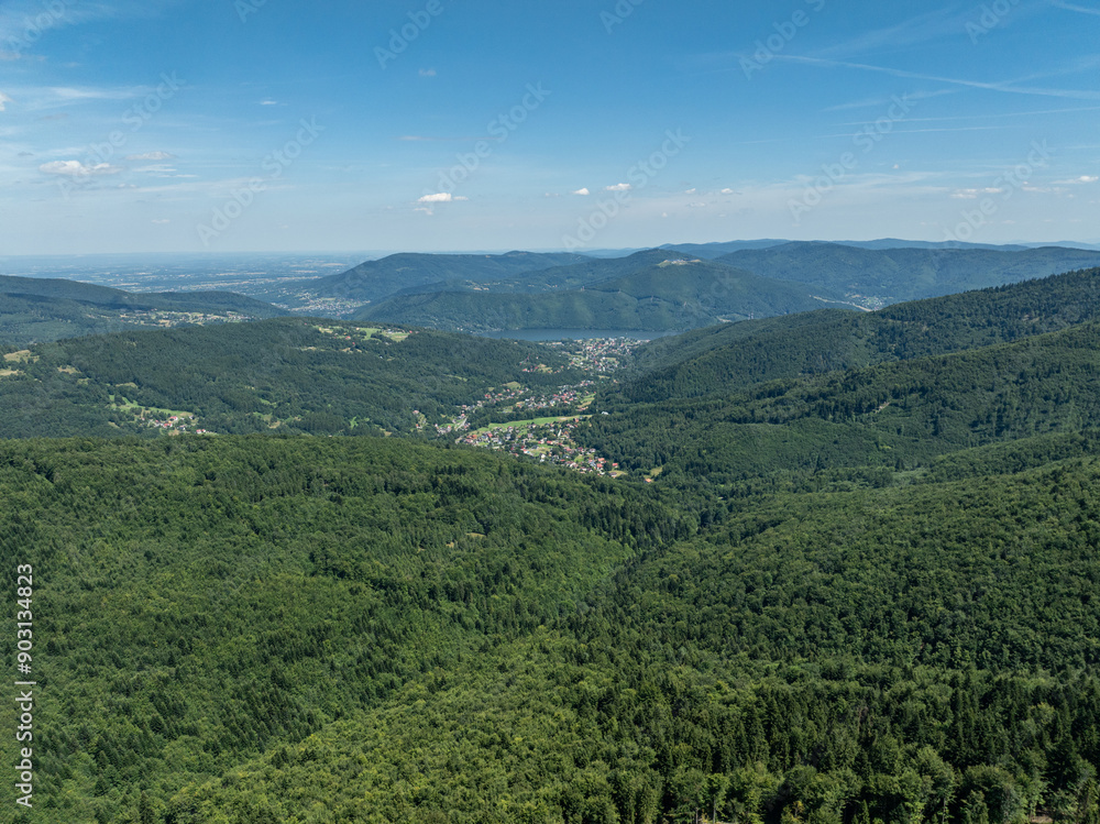 Fototapeta premium Beskid summer mountains panorama. Stunning drone view of summer green forests in the Beskids, Bielsko-Biała,Lake Zywieckie, Gora Zar, .