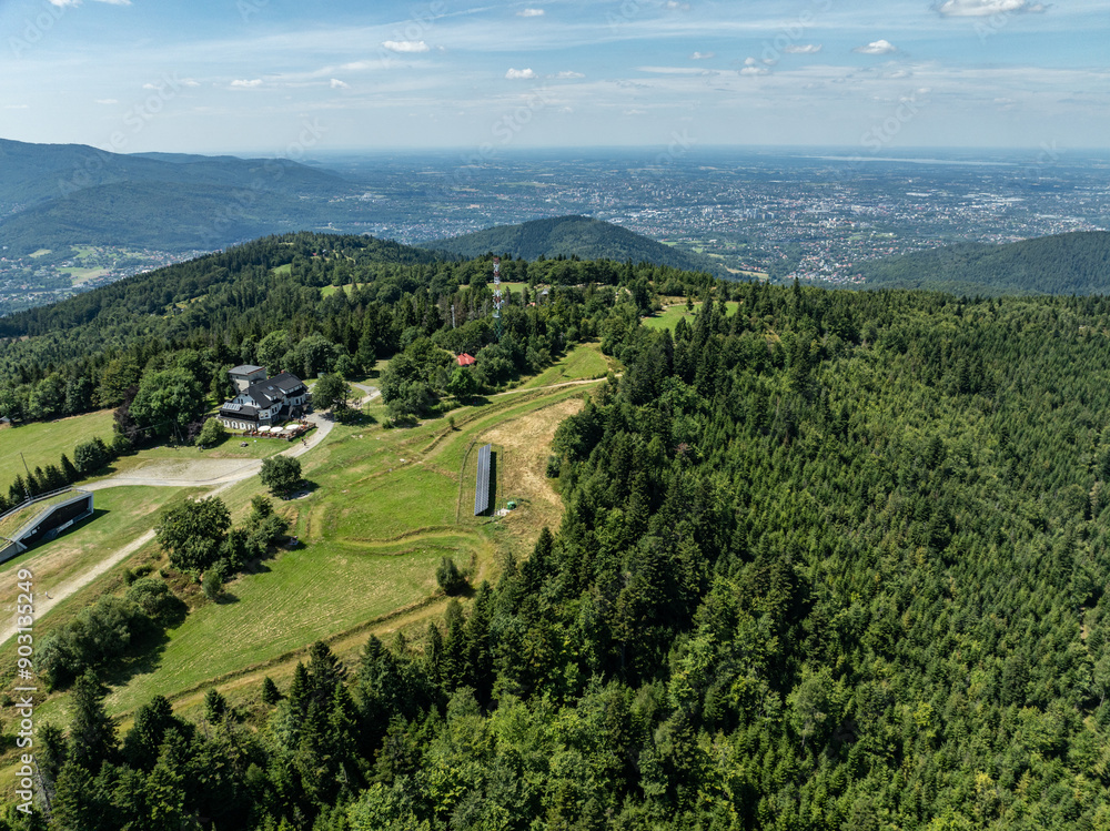 Stunning aerial drone view of summer green forests in the Beskids, Bielsko Biała, Magurka Wilkowicka. Shelter on Magurka Wilkowicka. Beskid summer mountains panorama. Stunning aerial drone view of summer green forests in the Beskids, Bielsko Biała, Magurka Wilkowicka. Shelter on Magurka Wilkowicka. Beskid summer mountains panorama.