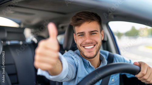 Smiling student driver giving a thumbs up from inside the car after passing the test 
