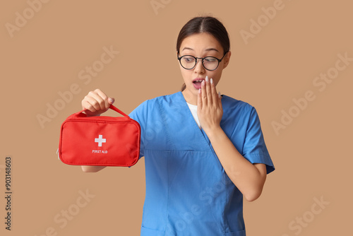 Surprised female doctor hol...