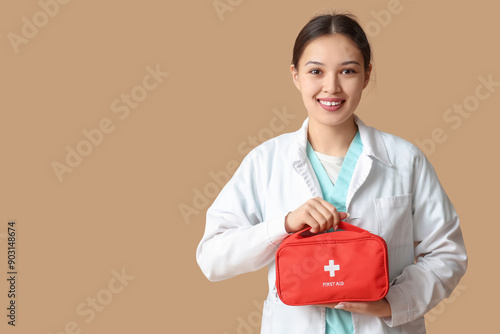 Happy Asian female doctor w...