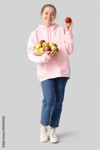 Smiling young woman in pink...