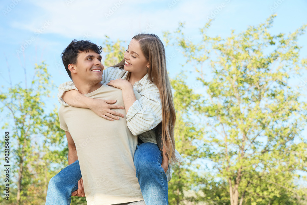 Beautiful young happy couple having fun in summer park Beautiful young happy couple having fun in summer park